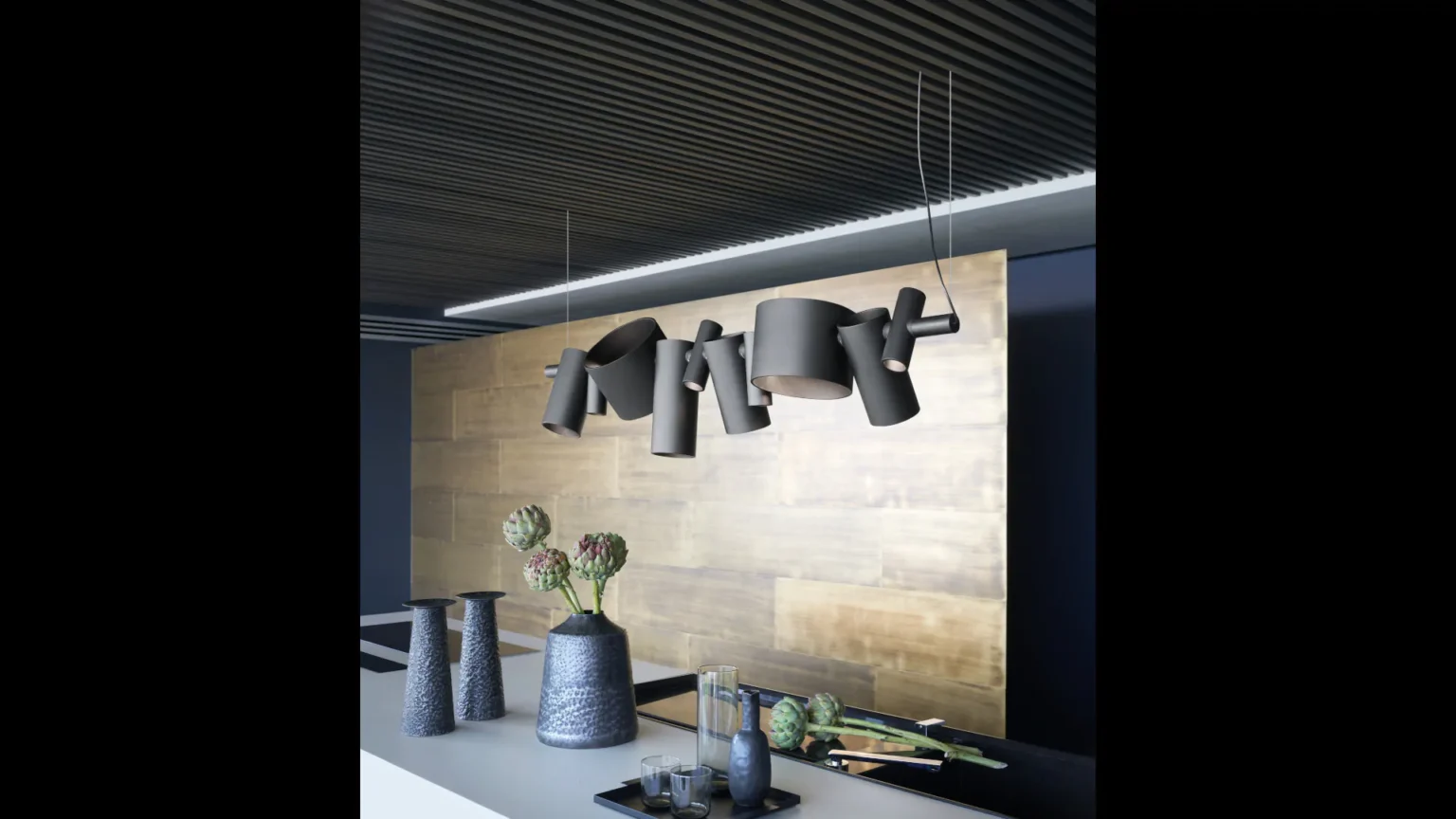 “Dancing Queen by Oluce modern Italian pendant light – sculptural suspended design with fluid metallic frame and soft ambient glow”