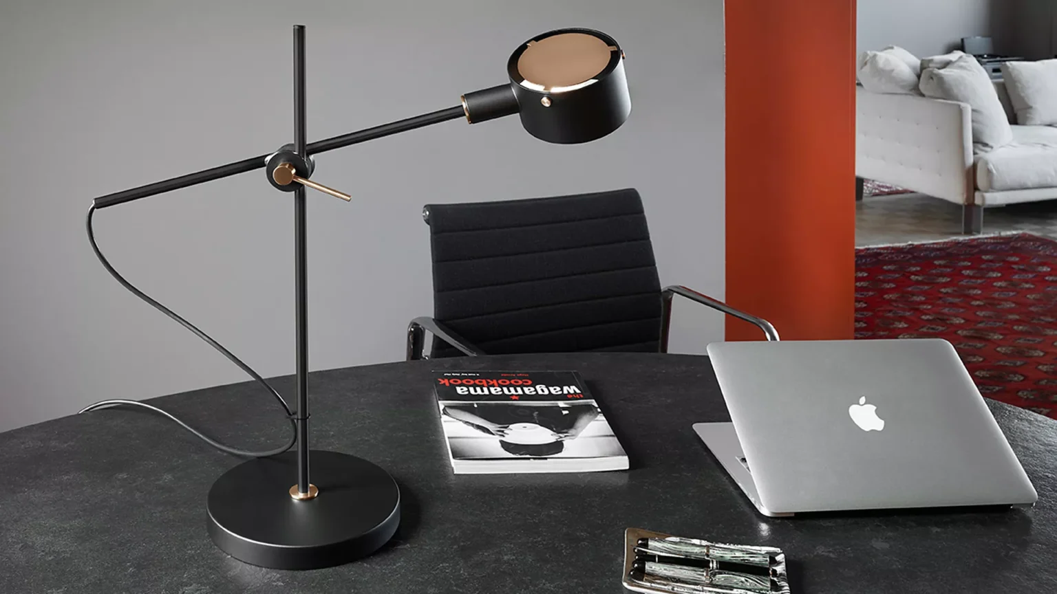“G.O. by Oluce stylish Italian lamp – compact sculptural lamp with polished surface and modern aesthetic”