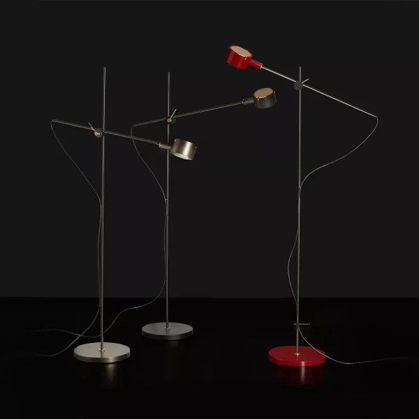 “G.O. by Oluce modern Italian table lamp – cylindrical fabric shade with sleek metal stem and round base”