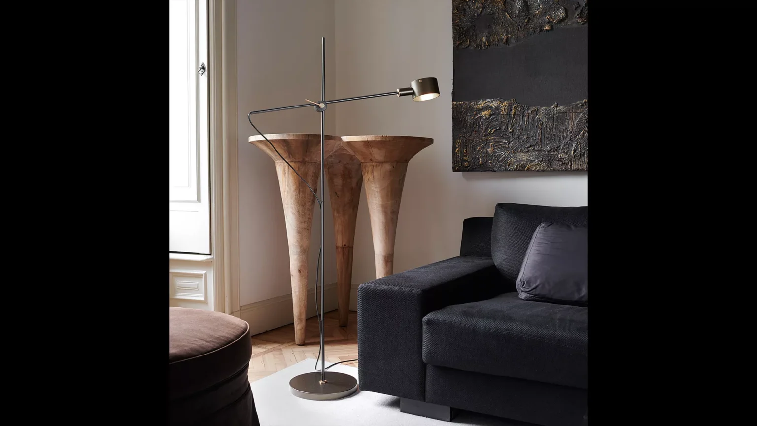 “G.O. by Oluce contemporary lighting – refined table lamp featuring soft fabric shade and polished metal finish”