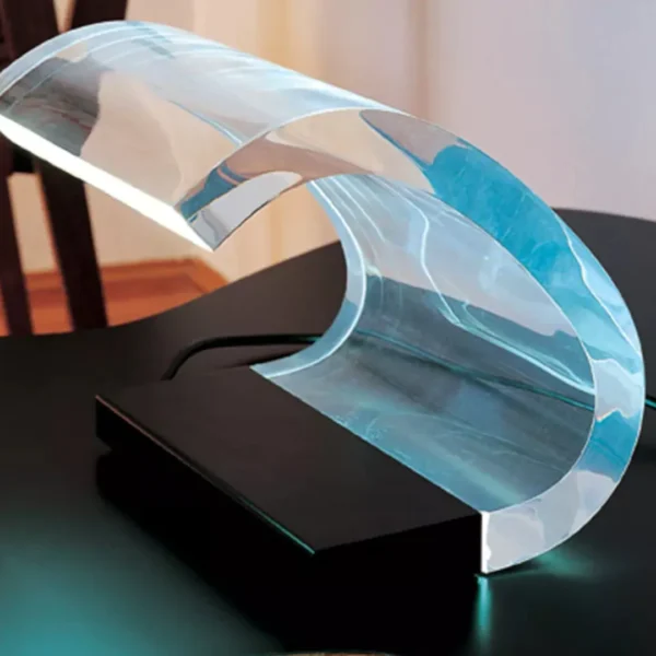 “Acrilica by Oluce modern Italian table lamp – iconic transparent curved acrylic design with sleek base”