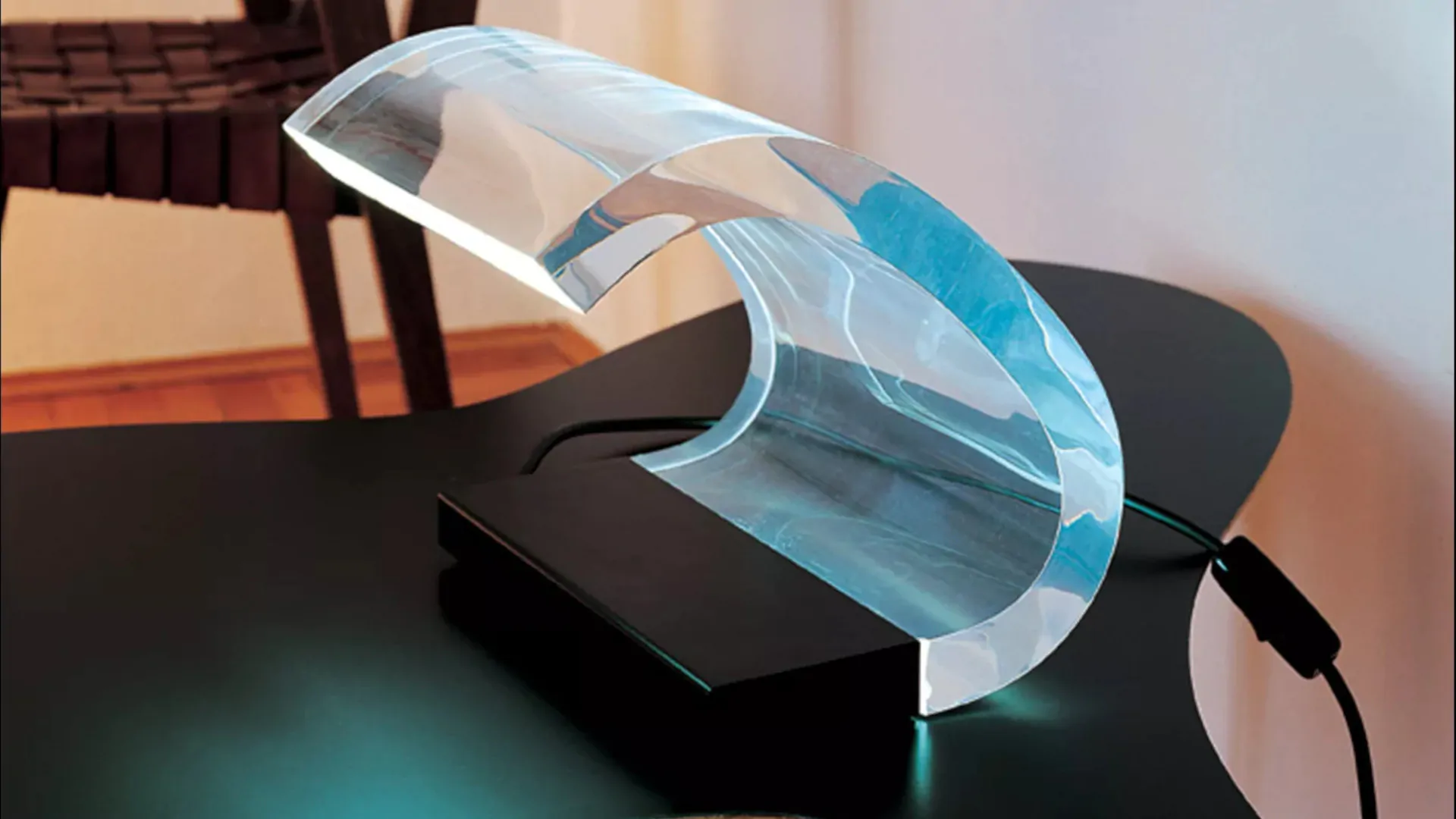 “Acrilica by Oluce modern Italian table lamp – iconic transparent curved acrylic design with sleek base”