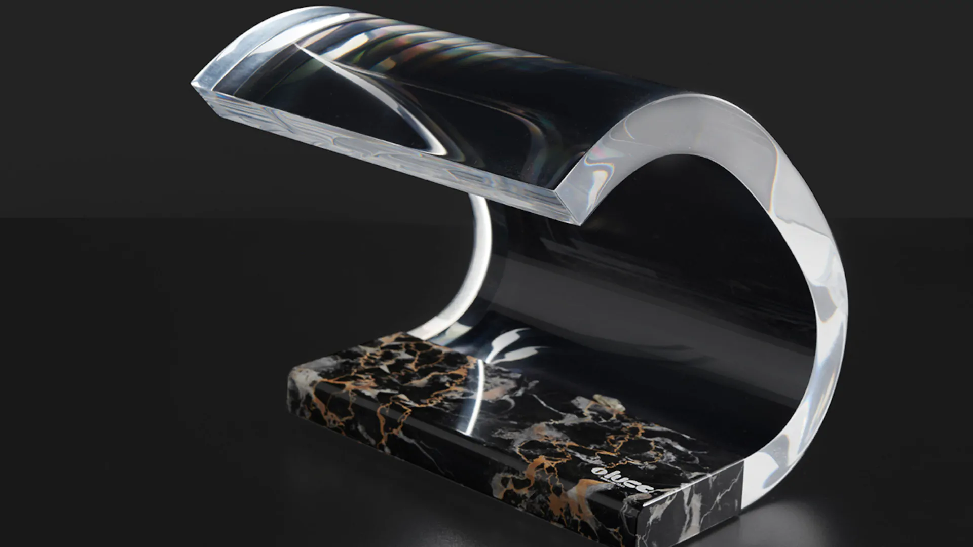 “Acrilica by Oluce iconic Italian table lamp – curved transparent acrylic diffuser with metal base, modern design”