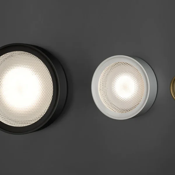 “Berlin-Out by Oluce stylish outdoor lighting fixture – minimalist round wall-mounted lamp with durable materials for garden or patio”