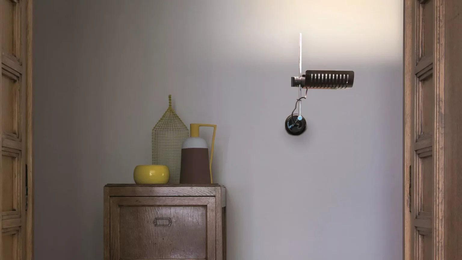 “Colombo by Oluce modern Italian floor lamp – sleek chrome structure with adjustable spotlight head and minimalist design”