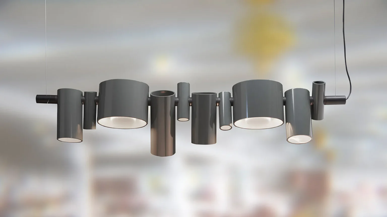 “Dancing Queen by Oluce artistic Italian ceiling lamp – flowing pendant structure with sleek finish and warm atmospheric lighting”