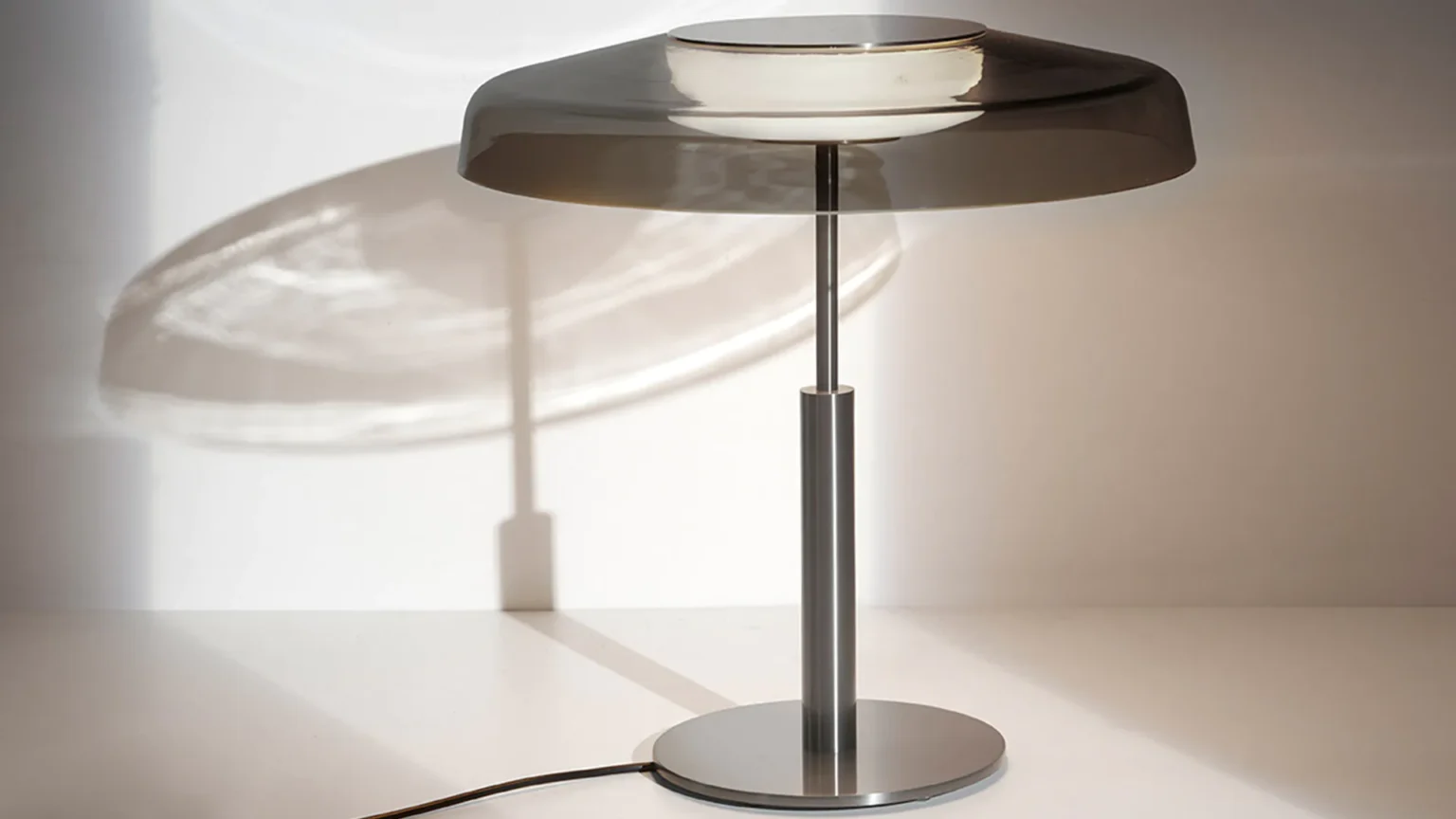 “Dora by Oluce Italian modern lighting – compact dome lamp with polished finish and timeless design”