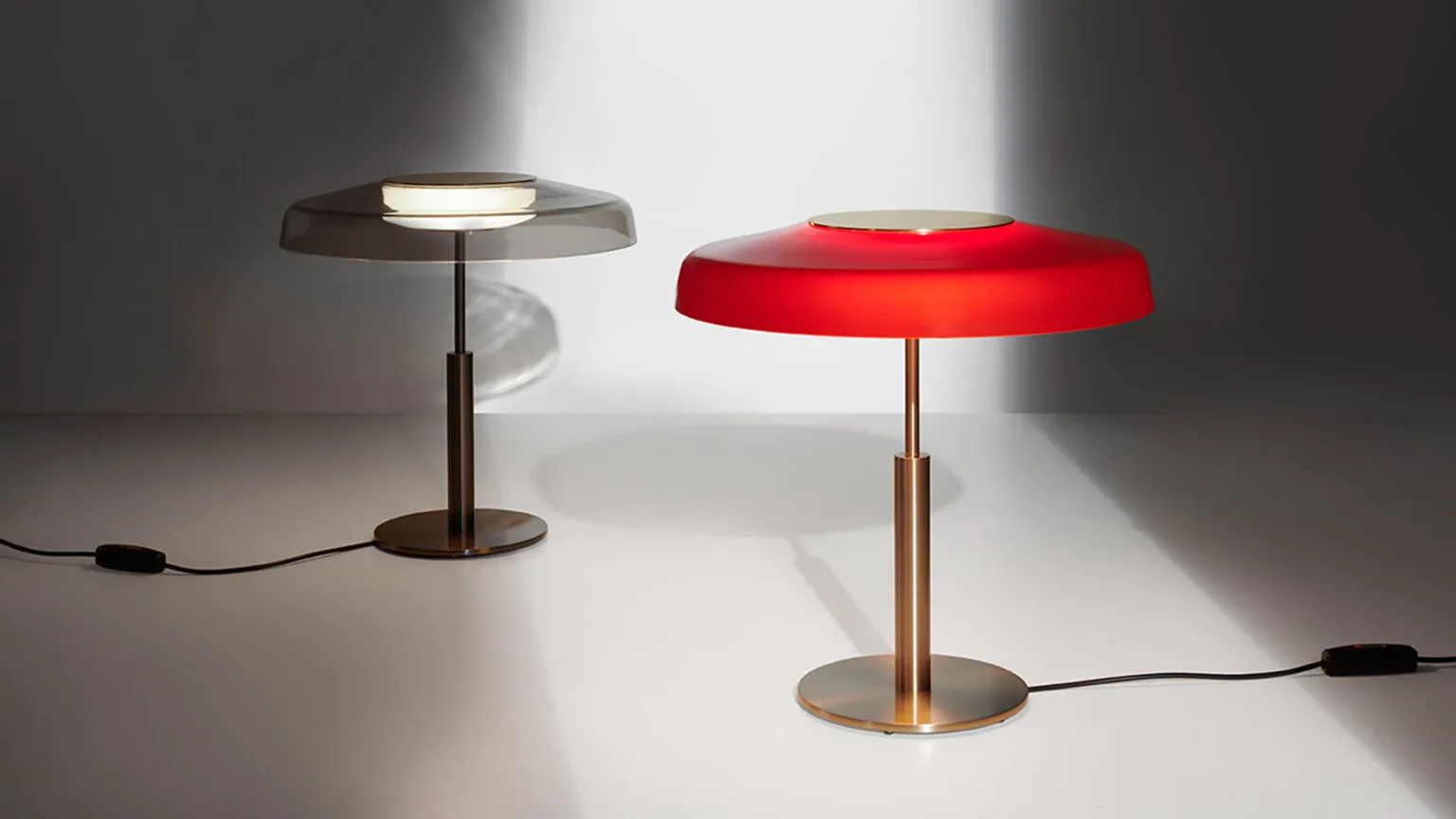 “Dora by Oluce modern Italian table lamp – elegant dome-shaped glass shade with sleek metal base”