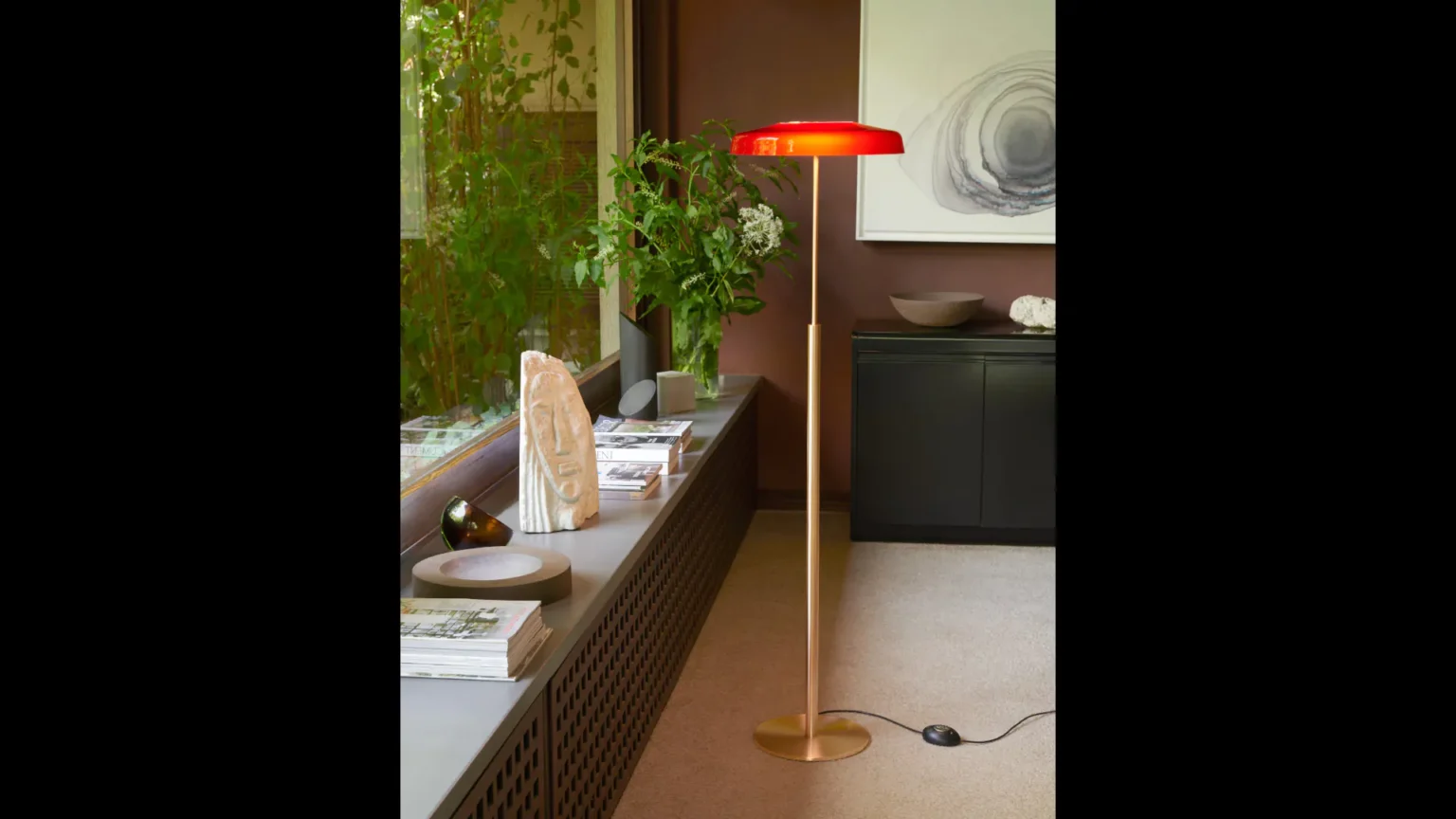 “Dora by Oluce modern Italian table lamp – compact glass globe with sleek metal base and minimalist design”