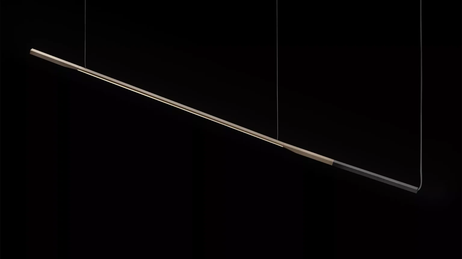 “Ilo by Oluce modern Italian pendant light – slim linear aluminum body with suspended LED bar and minimalist elegance”