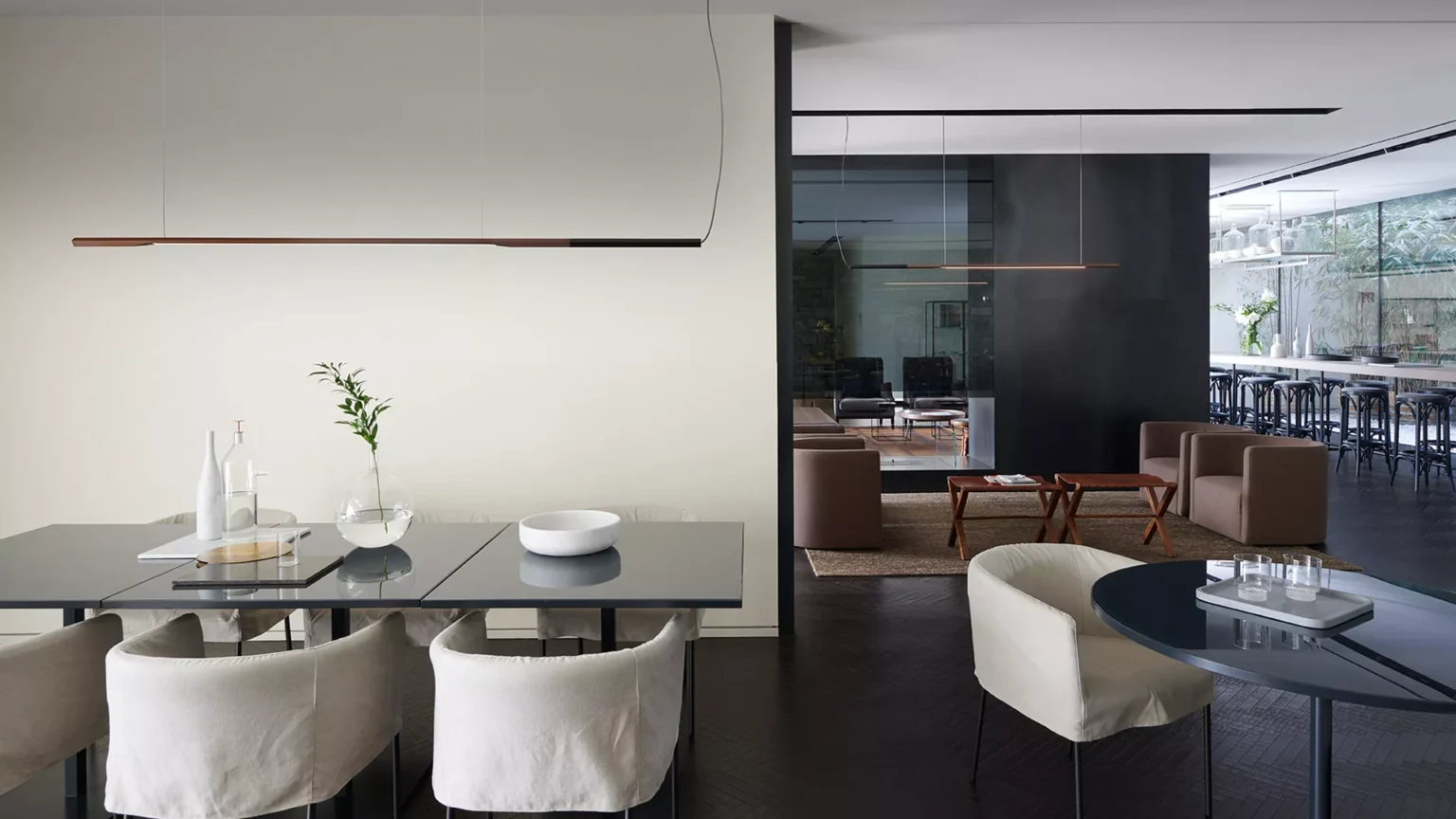 “Ilo by Oluce contemporary designer lighting – sleek suspended lamp with elongated metallic tube and balanced geometric design”