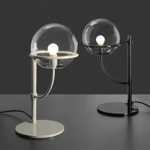 “Lyndon by Oluce modern Italian floor lamp – minimalist design with globe-shaped glass and polished metal structure for ambient illumination”