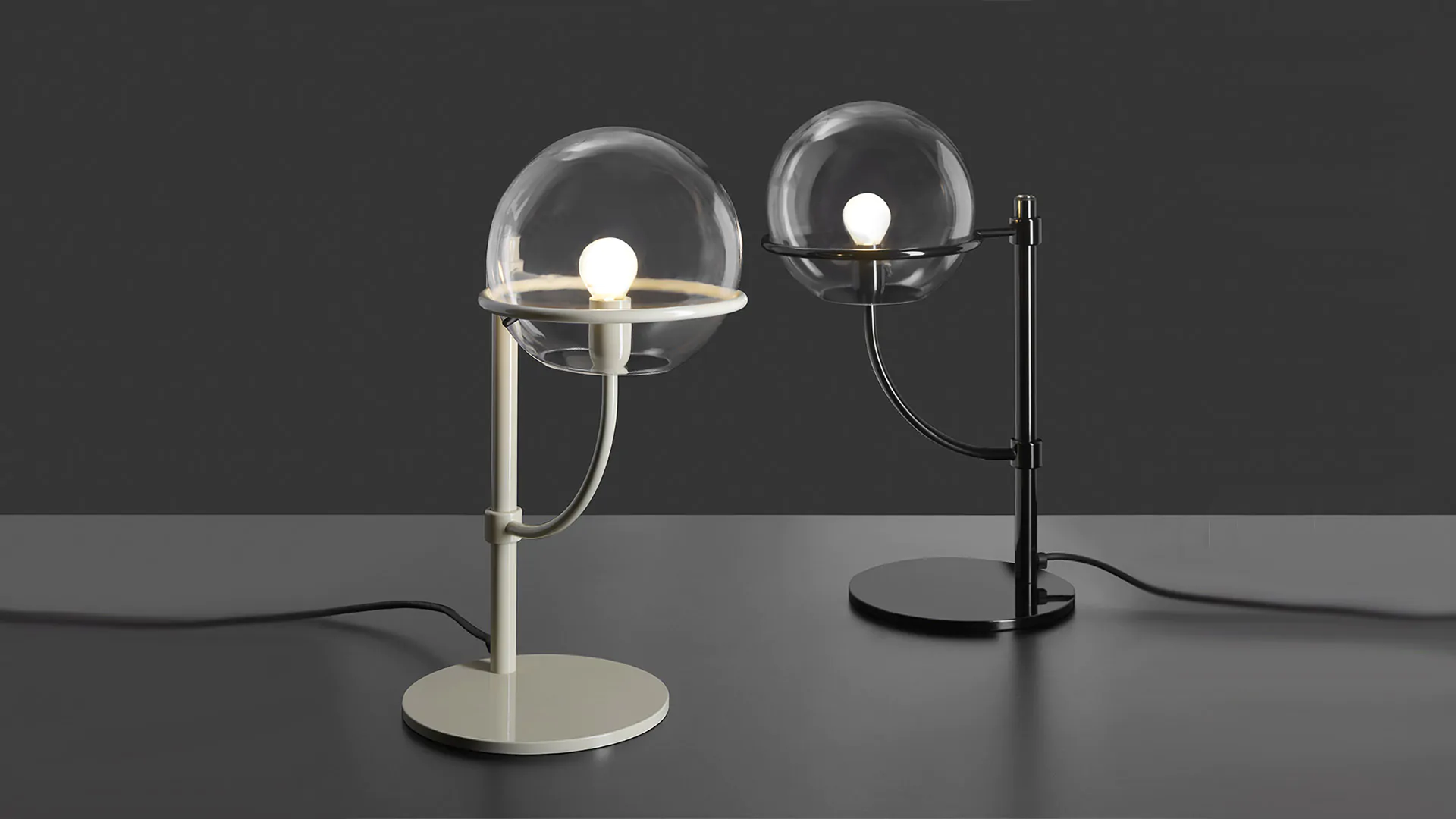 “Lyndon by Oluce modern Italian floor lamp – minimalist design with globe-shaped glass and polished metal structure for ambient illumination”