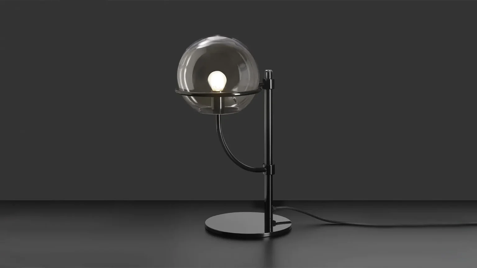 “Lyndon by Oluce contemporary outdoor lamp – large spherical glass diffuser on slender chrome frame for elegant architectural lighting”