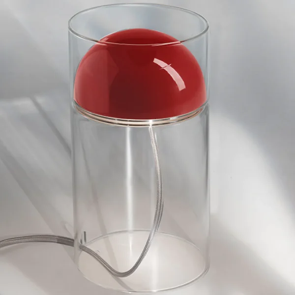 “Medusa by Oluce modern Italian table lamp – fluid glass form with glowing diffuser and sculptural elegance”
