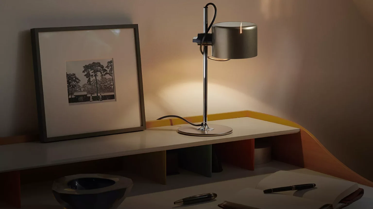 “Mini Coupé by Oluce contemporary lighting – colorful compact lamp with vintage-inspired design and metallic accents”