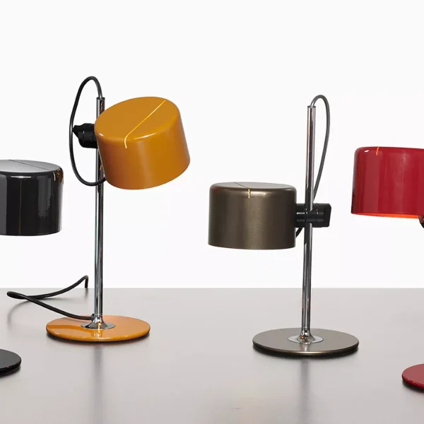 “Mini Coupé by Oluce modern Italian table lamp – compact curved metal shade with sleek minimalist design”