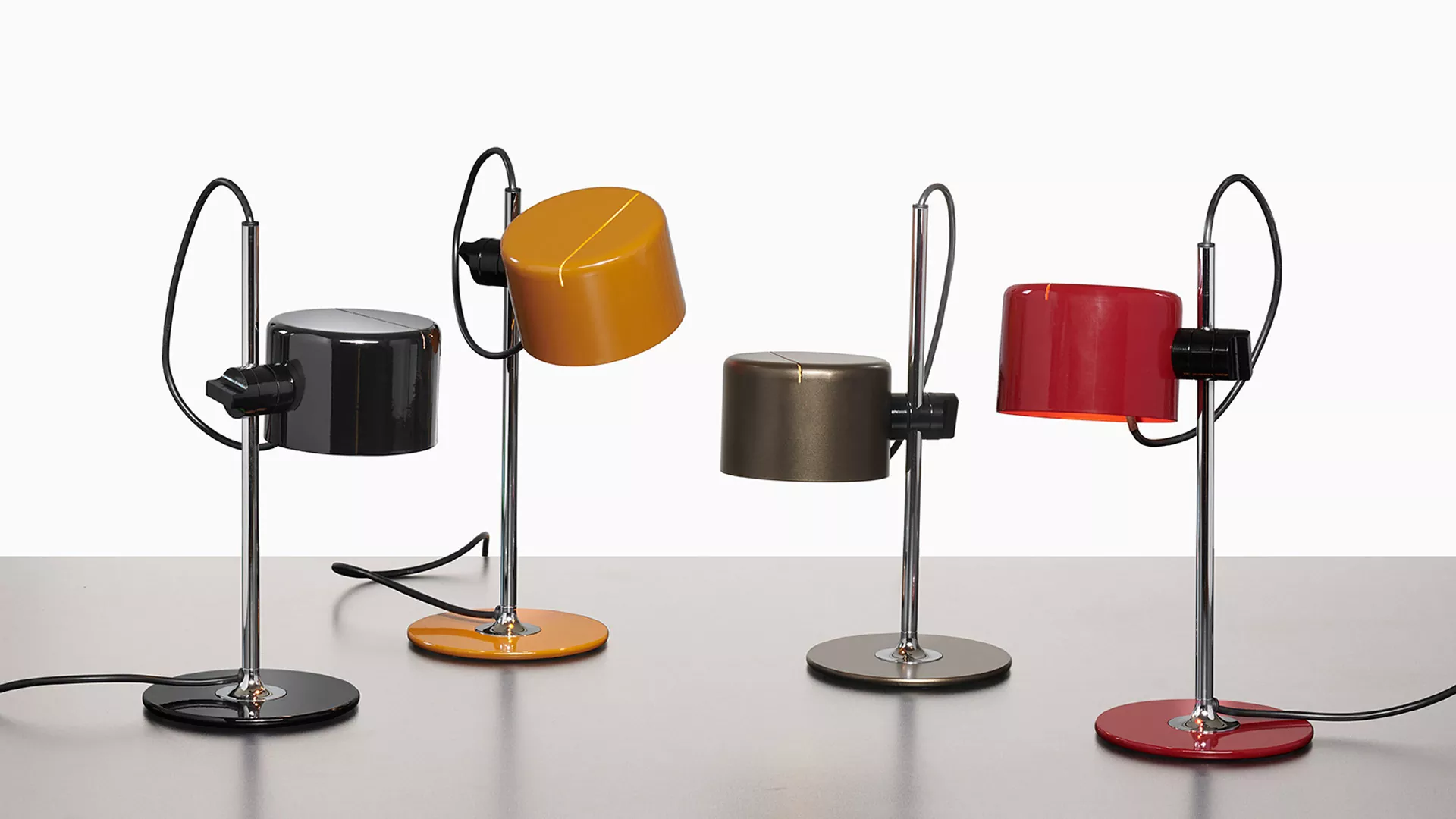 “Mini Coupé by Oluce modern Italian table lamp – compact curved metal shade with sleek minimalist design”