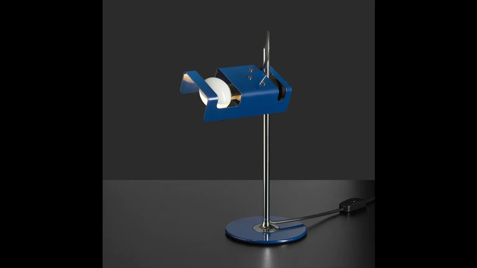 “Mini Spider by Oluce modern Italian table lamp – adjustable spotlight head on slim metal base for focused task lighting”