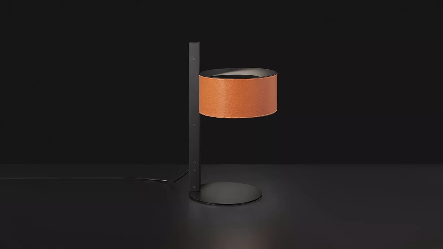 “Parallel by Oluce designer lighting – contemporary table lamp with metal base and softly glowing glass shade”
