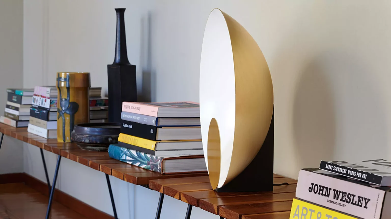 “Siro by Oluce designer lighting – contemporary table lamp with disc-shaped form and indirect ambient glow”