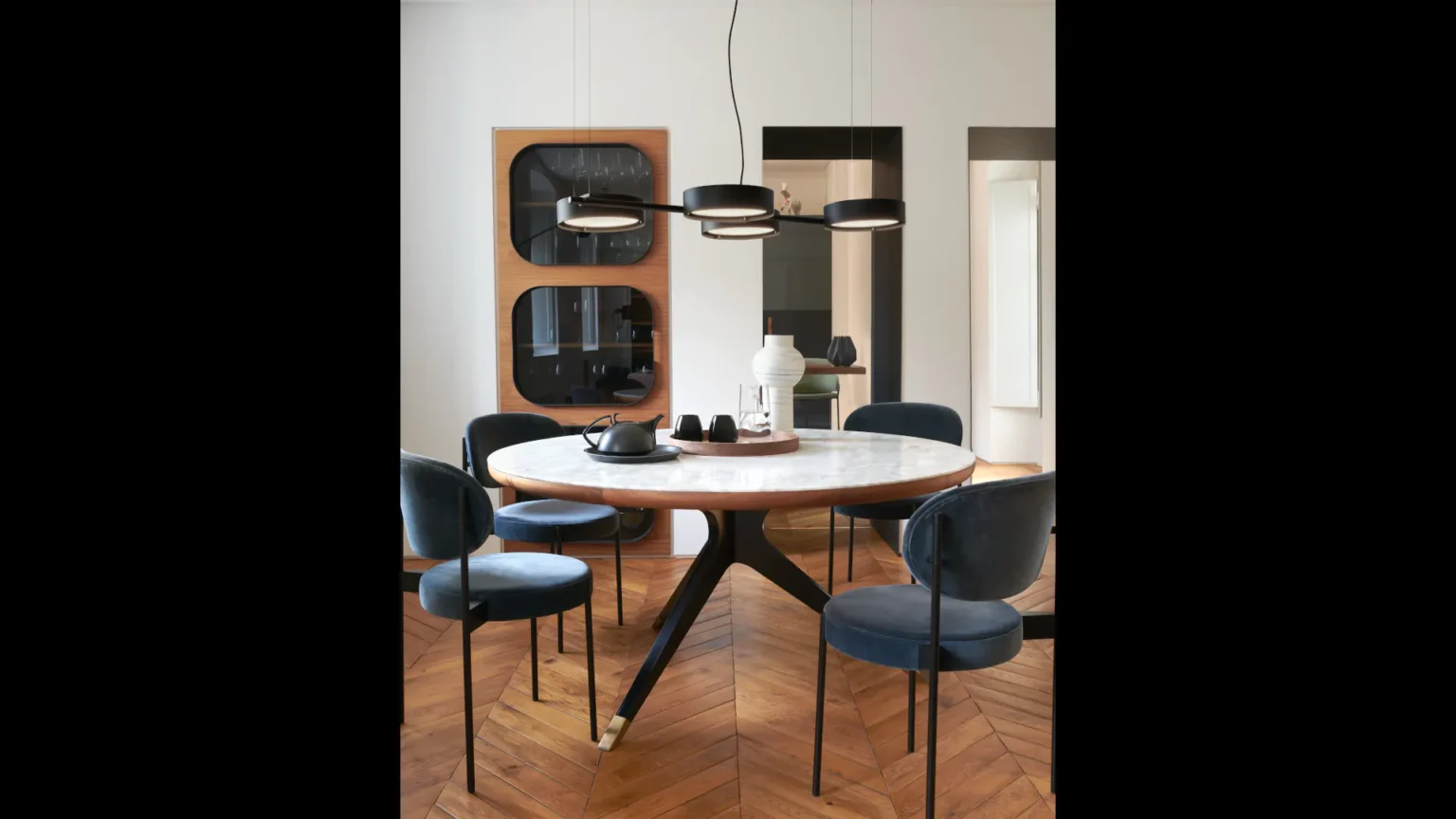 “Berlin by Oluce stylish Italian wall lamp – sleek circular shape with frosted glass and clean metal accents”