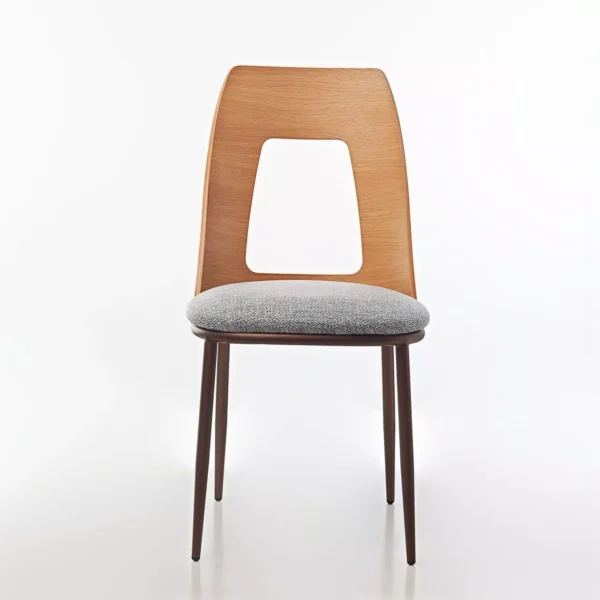 Opus W chair by Peressini featuring a gently curved, fully upholstered seat and backrest, supported by sleek metal legs.