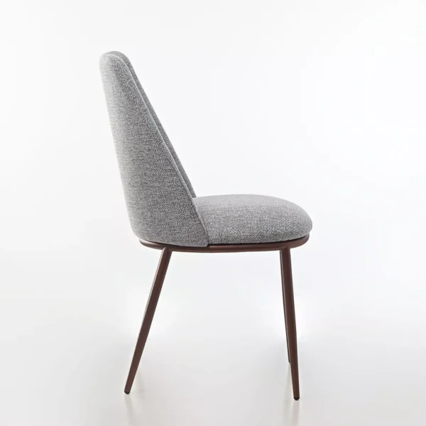 Peressini Opus Dining Chair featuring a minimalist design with a fully upholstered seat and backrest, supported by a durable steel frame with tapered metal legs, available in various fabric and leather finishes.