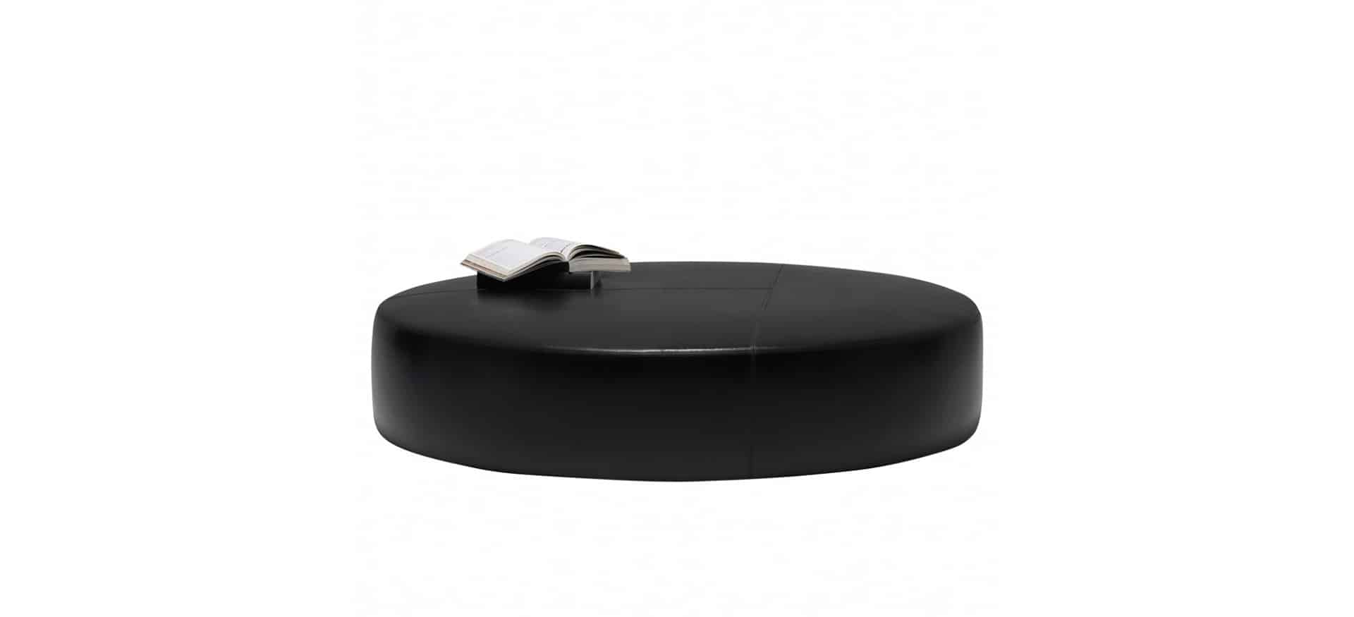 Round upholstered ottoman with modern style