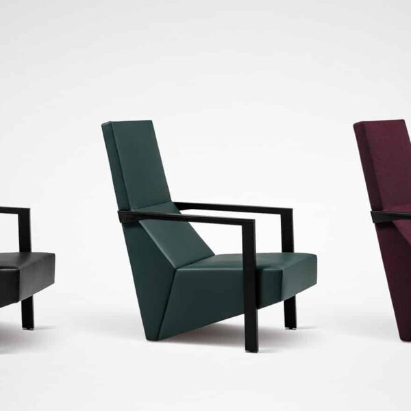 Modern chair with unique puzzle-piece design and upholstered seat by Camerich.