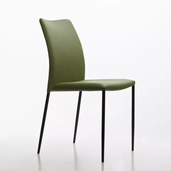 Peressini Pola chair in emerald green upholstery with slim black metal legs, shown against a neutral studio backdrop.