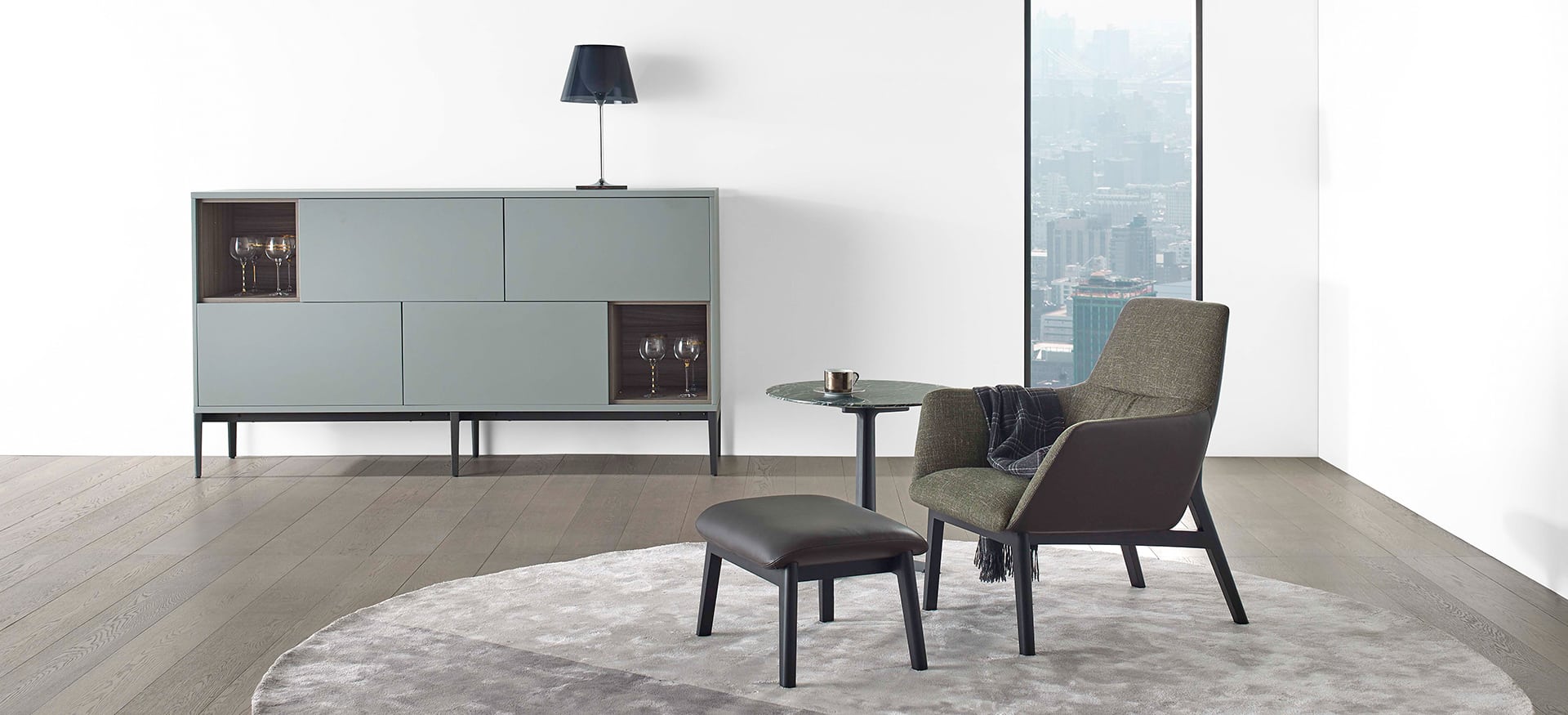 Modern low-back chair with soft upholstery and sleek wooden frame by Camerich.