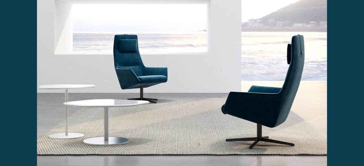 Softly upholstered high-back chair with sleek wooden legs by Camerich.