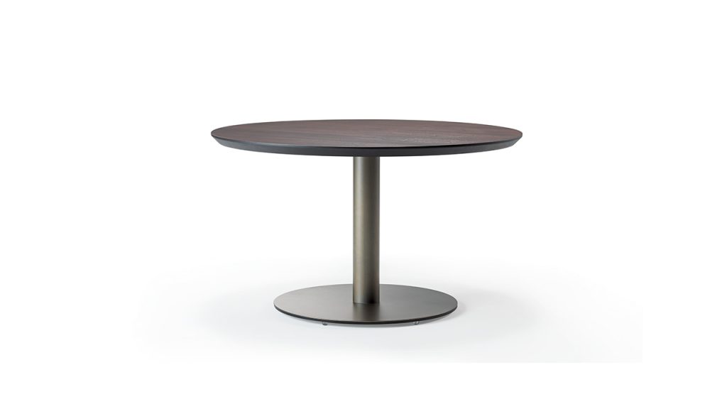 Modern round glass table in Troy Michigan showroom