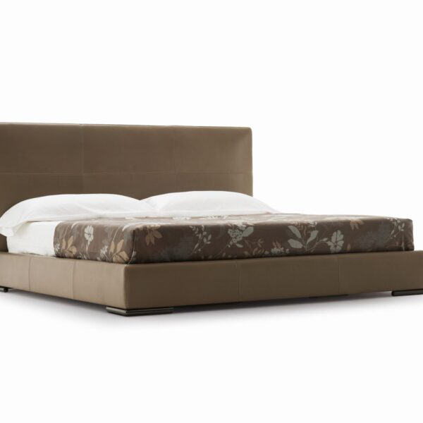Elegant upholstered bed with high headboard and modern design by Camerich.