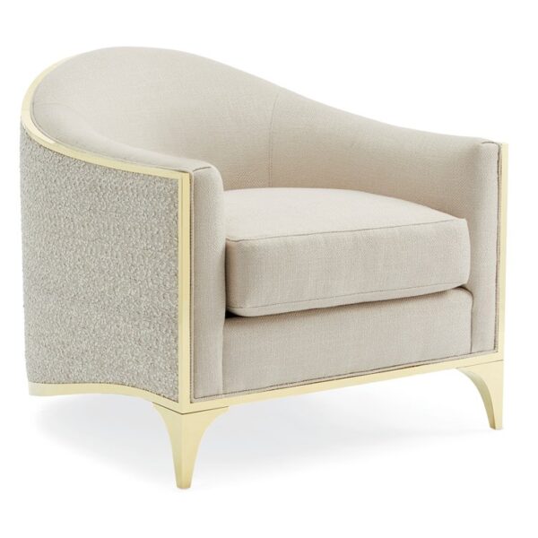 The Svelte Chair by Caracole, a sophisticated barrel chair with a shimmering Moonstone basketweave fabric interior, a tone-on-tone novelty eyelash embroidery exterior, and a Majestic Gold stainless steel frame.