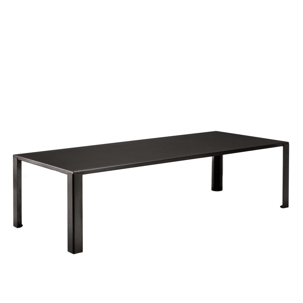 “BIG IRONY Table by Zeusnoto featuring a flat rectangular metal top with matching angular metal legs in a matte finish.”