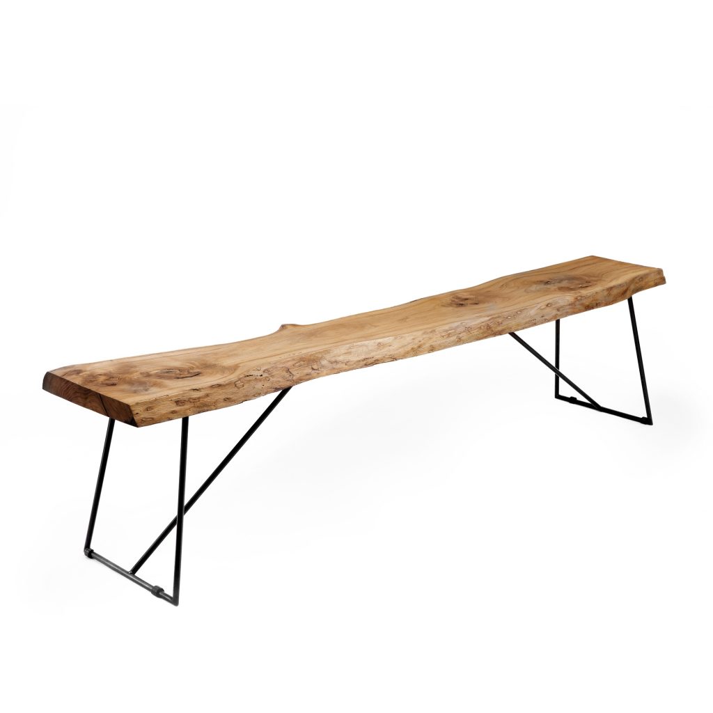 Solid aged olive‑wood bench on slender copper‑black epoxy steel frame.