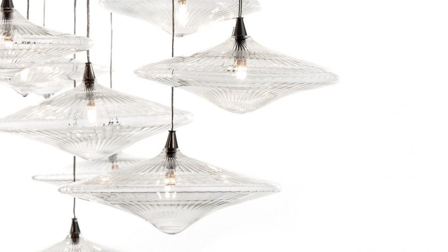 Luxurious Sirius lighting fixture with polished metal and crystal