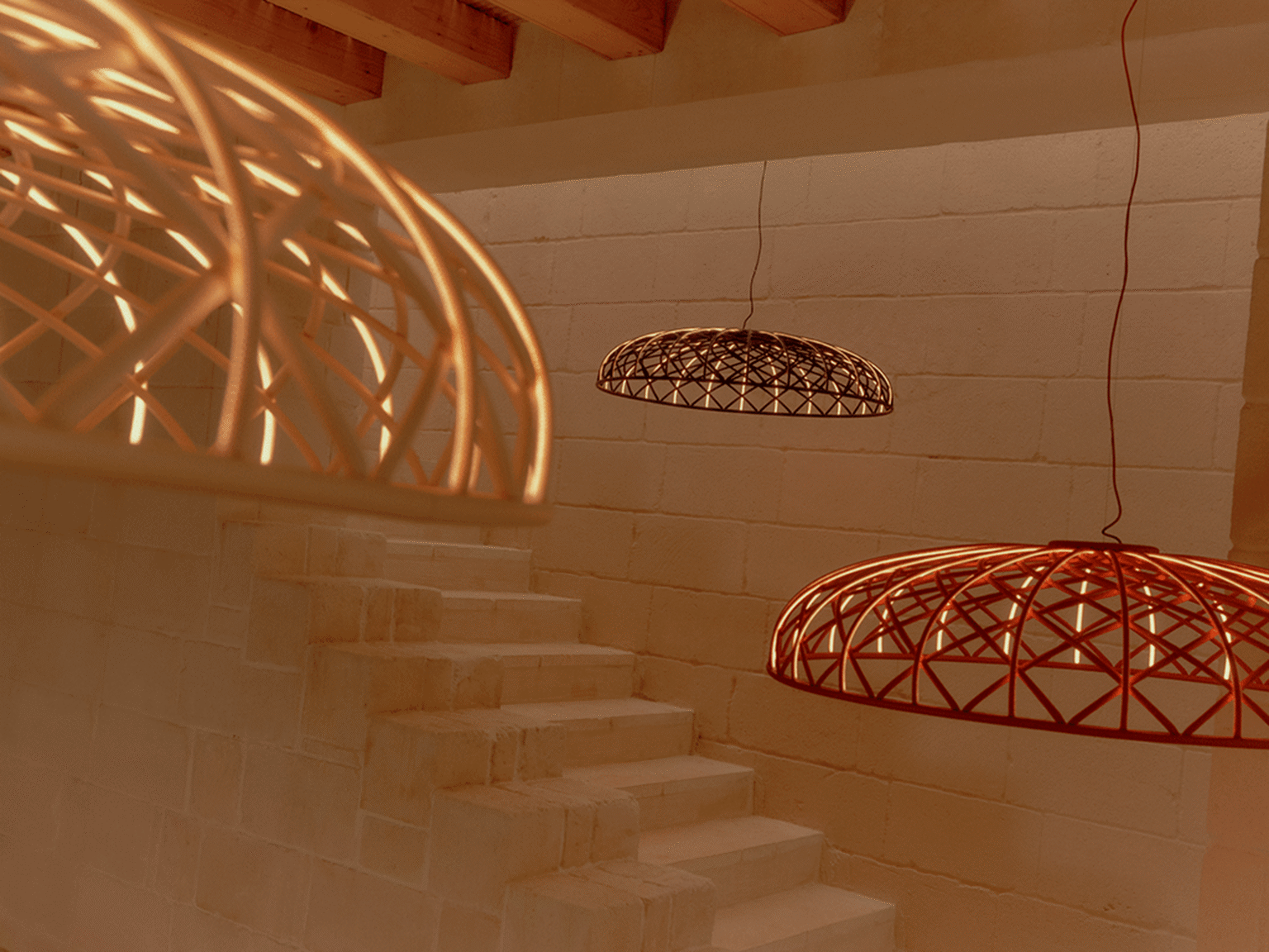 Side view of anthracite Skynest lamp showing interlaced tubular mesh lit from within by LED strips across the dome.