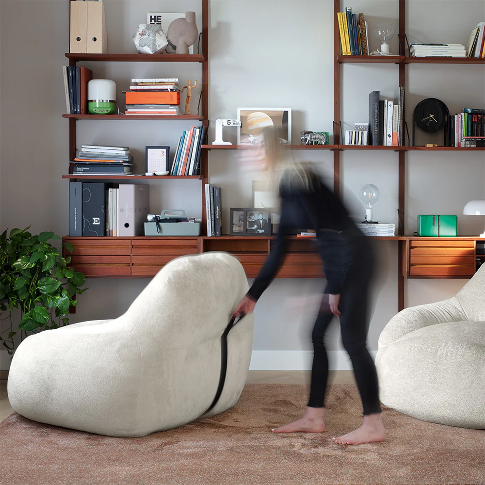 “TENDER accent chair by Connubia in elegant setting – inviting design perfect for living rooms, reading nooks, or lounges”