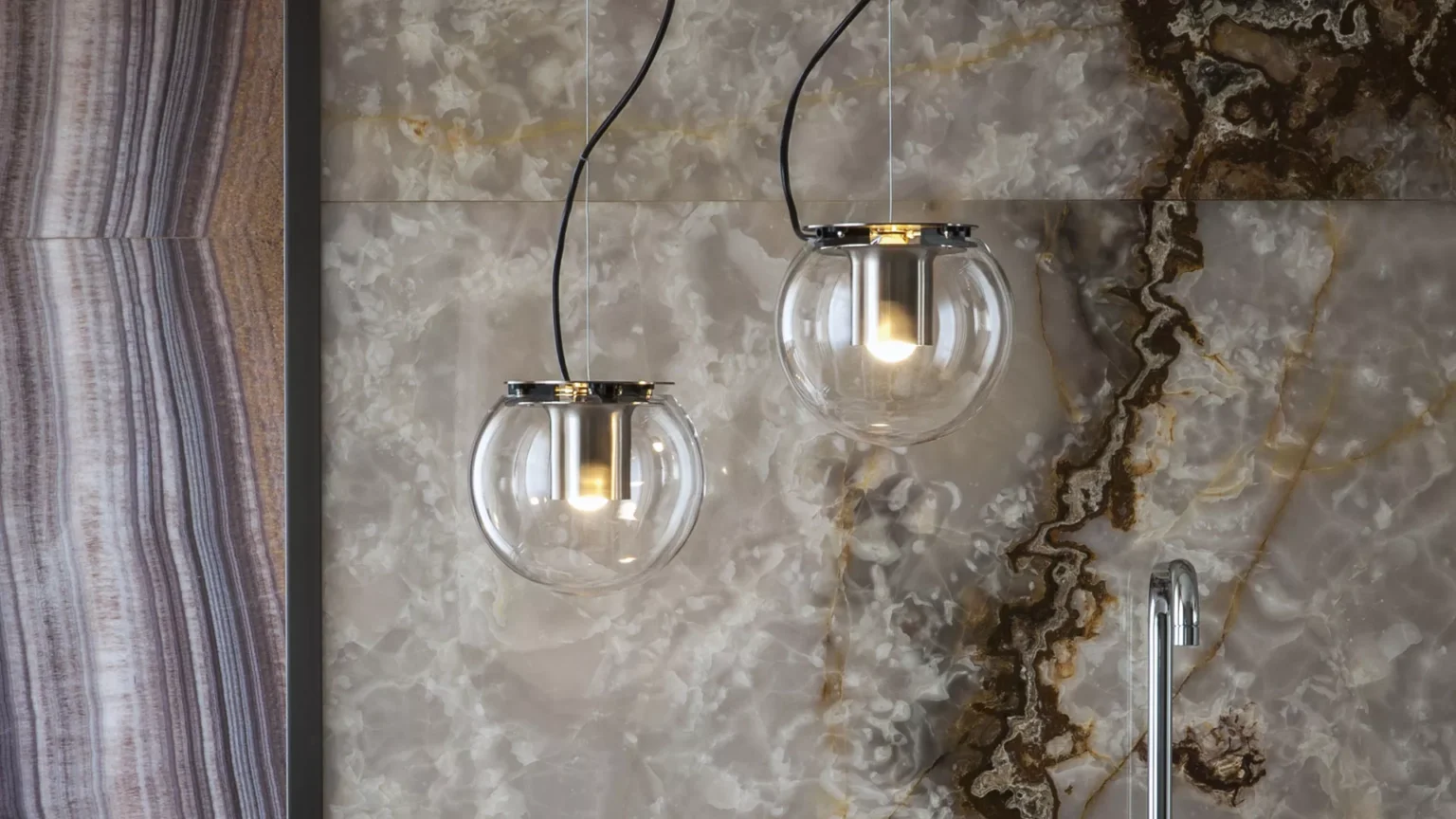 “The Globe by Oluce contemporary designer lighting – elegant globe-shaped lamp featuring polished metal accents and soft ambient light”