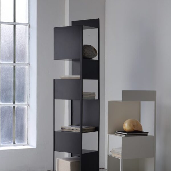 Compact side table with sculptural steel form by Zeusnoto.