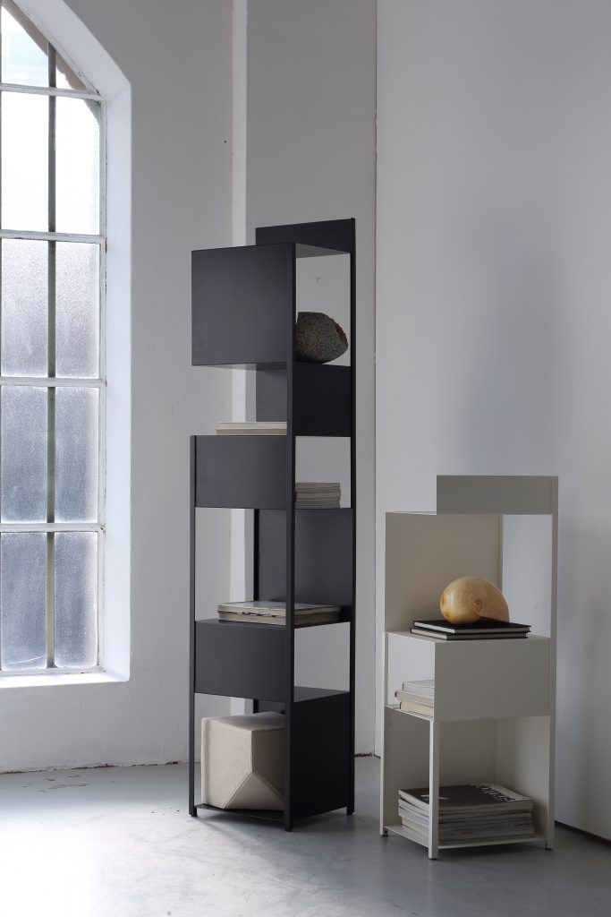 Compact side table with sculptural steel form by Zeusnoto.