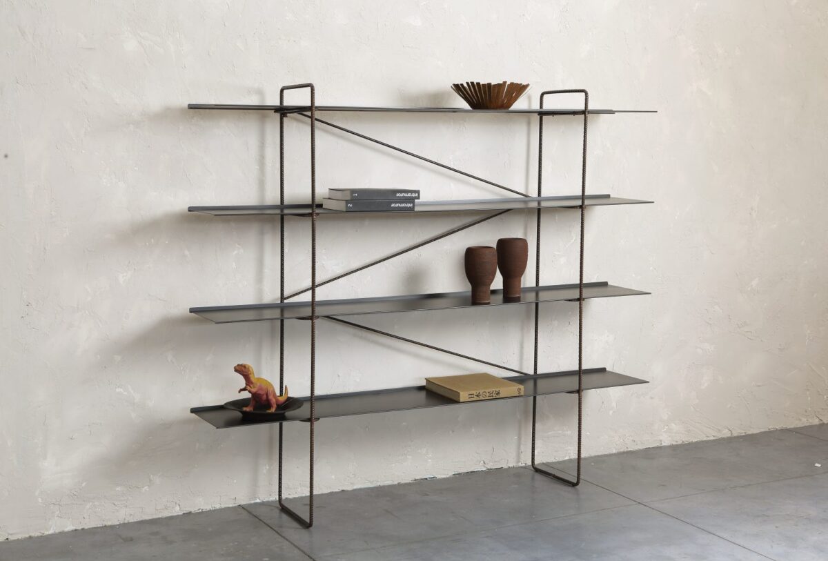 Curved steel bookcase with open circular frame by Zeusnoto.