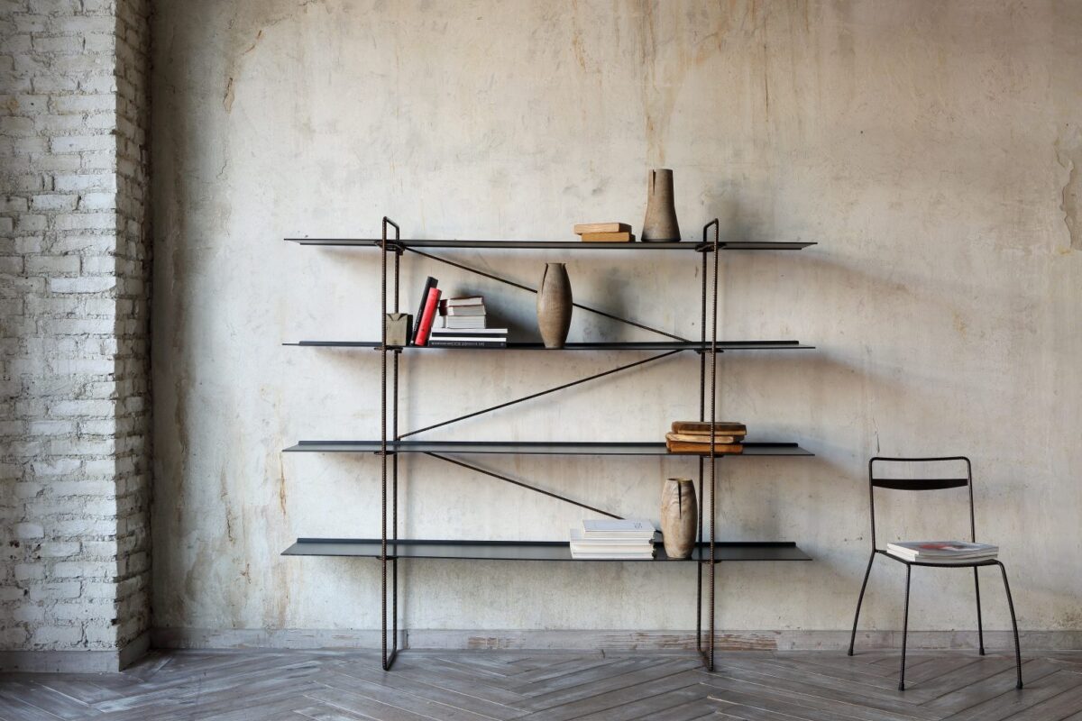 Curved steel bookcase with open circular frame by Zeusnoto.