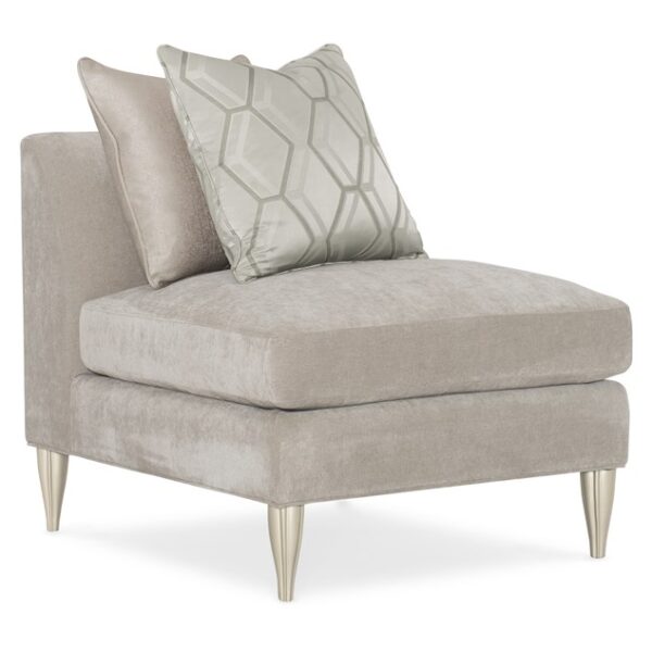 Caracole Fret Knot sectional with removable seat cushions and fluted feet, offering both style and comfort for modern living spaces.