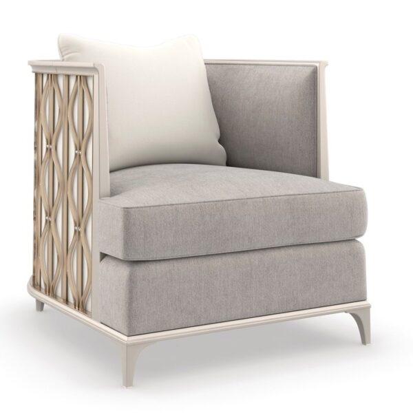 Back In Style chair by Caracole with a sculpted backrest and plush upholstery.