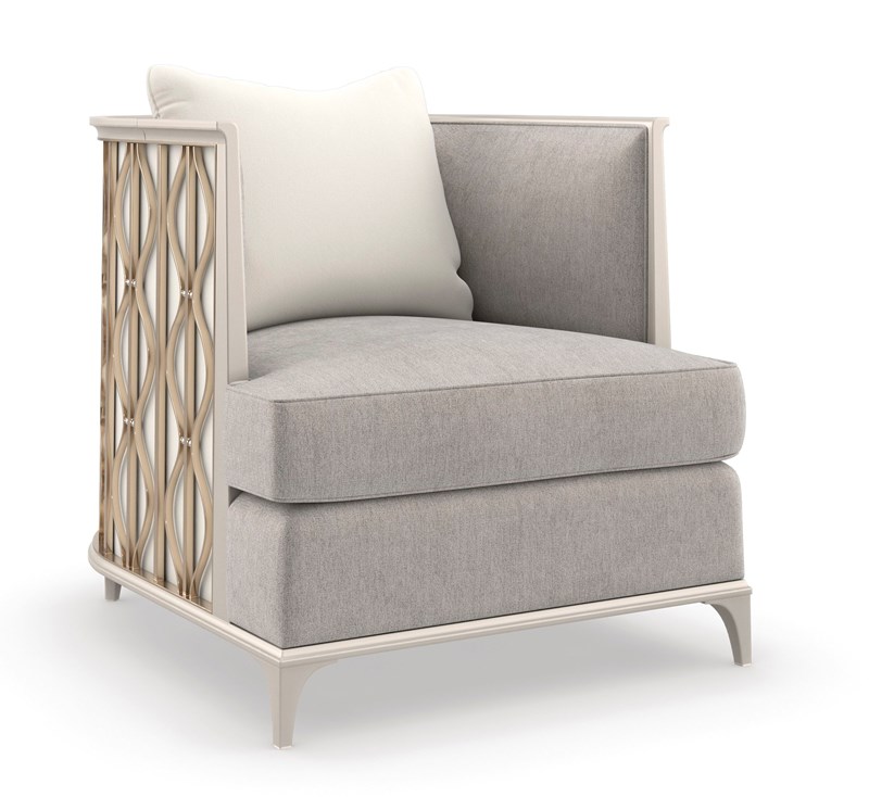 Back In Style chair by Caracole with a sculpted backrest and plush upholstery.