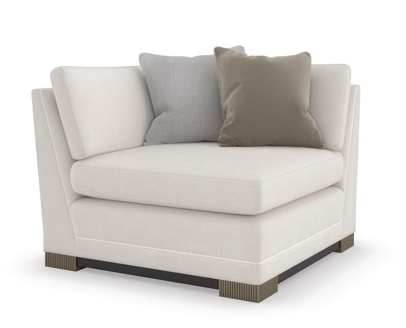 Caracole Deep Retreat modular sectional featuring a classic shelter style with a softly textured chenille performance fabric in white, complemented by braided leather welt detailing, fluted Silver Shadow legs, and a Dark Chocolate wood base, offering luxurious comfort and modern elegance.